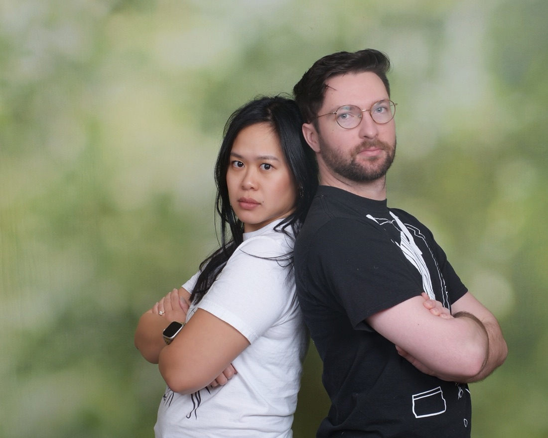 Derek and Nhi back to back with arms crossed