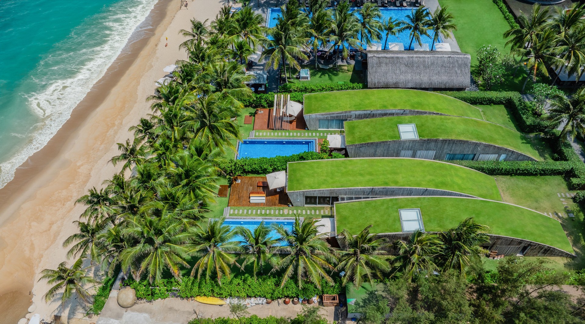 Aerial view of beachfront villas at Naman Retreat
